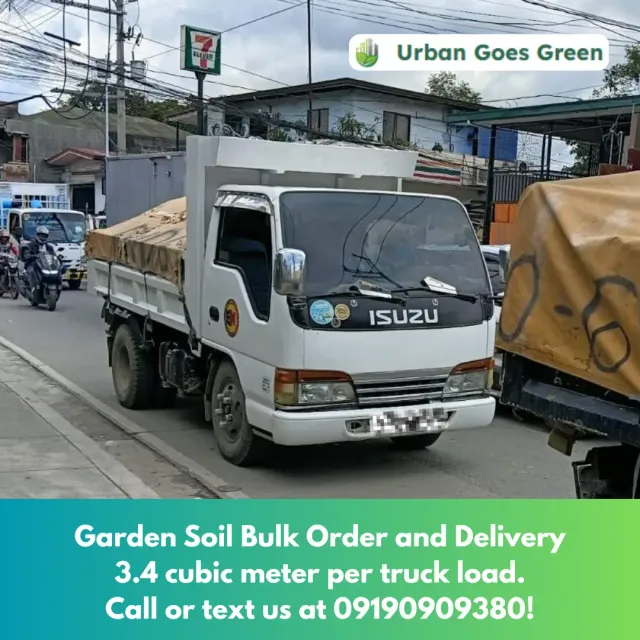 Elf truck loaded with garden soil for bulk delivery in Metro Manila
